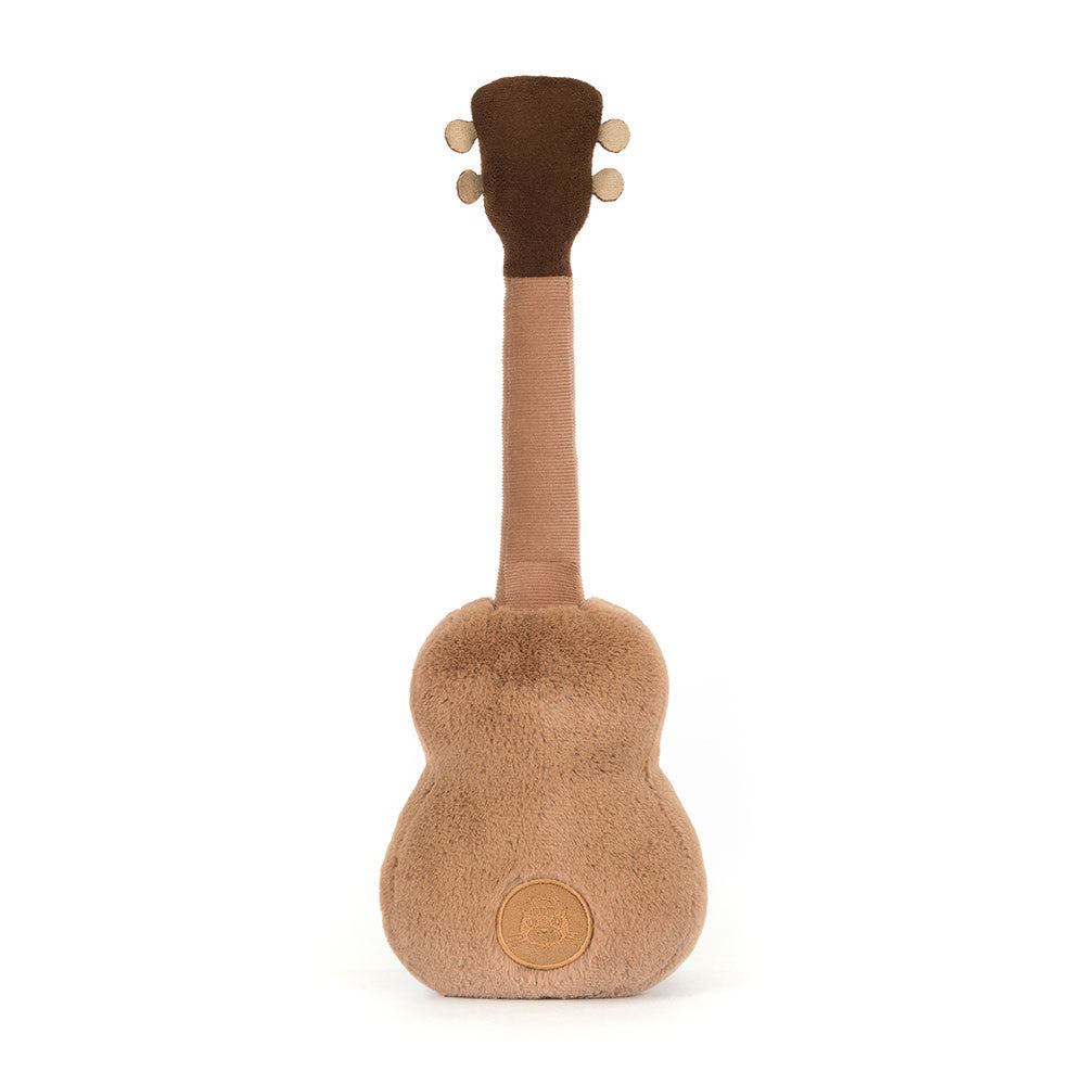 Back view of Jellycat Amuseables Ukulele soft toy showing textured brown plush and stitched logo detail.