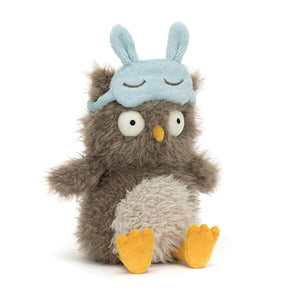 Angled View: Looking for some shuteye style? The Jellycat Audrey Hootsoftly leans in, showcasing its mocha plush with bedhead fur and wide-awake bobble eyes. A blue suedette sleep mask with embroidered lashes adds to the sleepy charm. This owl is ready for cozy cuddles!