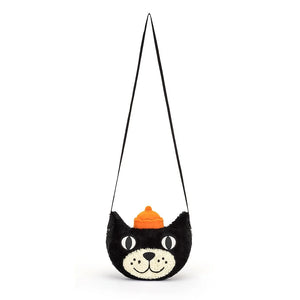 This Jellycat Jack Bag is a soft and stylish tote shaped like a cheeky black and white cat with big button eyes and a mischievous grin. He wears a signature orange jelly hat and a webbed crossbody strap.