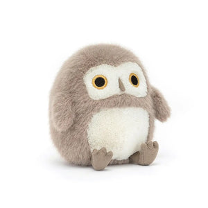 A close-up view of a Jellycat Barn Owling plush toy, facing straight ahead, showcasing its ultra-soft fur, big eyes, and cute buttercream tummy.