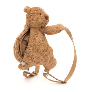 Angled View: Ready to explore! The Jellycat Bartholomew Bear Backpack leans forward, showcasing its soft toffee fur with chunky paws, perky ears, and a curious expression. Adjustable straps, a secure silver zip, and a gentle lining make this a comfy companion for little adventurers 