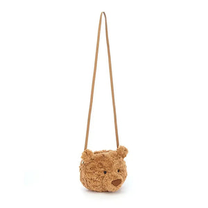 Heads will turn with the Bartholomew Bear Bag! This plush cross-body bag features a comfy strap & keeps essentials close. Perfect for stylish on-the-go fun.