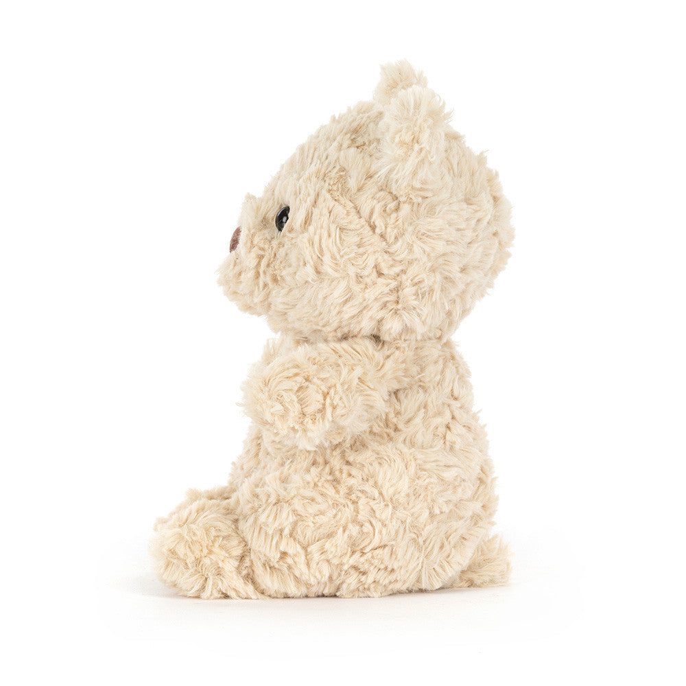 Bartholomew Bear Junior side view showing curly fur on white background