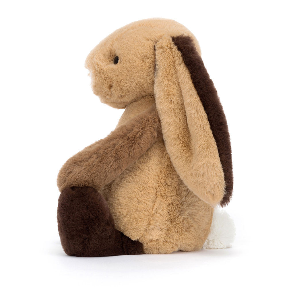 Side view of Jellycat Bashful Patchwork Brown Bunny - showing its plush texture and adorable sitting posture.