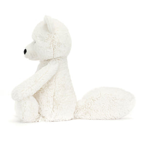 Side view of Jellycat Bashful Arctic Fox plush toy, showcasing his soft cream fur and weighted paws.