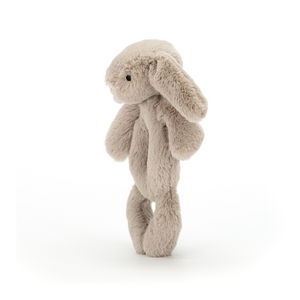 Shake, Rattle, & Roll! The Jellycat Bashful Beige Bunny Ring Rattle's easy-to-hold design encourages grabbing and motor skill development. (Side view)