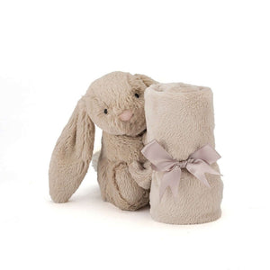 Ready for Comfort on the Go! The Jellycat Bashful Beige Bunny Soother's lightweight design and cuddly bunny with a rolled-up blanket make it a perfect travel companion. (Blanket rolled up but angled)