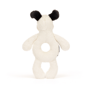 Mismatched Patches & Playful Sounds! The Jellycat Bashful Black & Cream Puppy Ring Rattle combines soft fur with a hidden tummy rattle for a delightful sensory experience. (Back view)