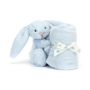 Jellycat Bashful Blue Bunny Soother at an angle, showcasing its soft fur, long floppy ears, and cuddly embrace with a neatly rolled fur square tied with a Baby Jellycat ribbon.