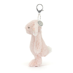 Side view of Jellycat Bashful Blush Bunny Bag Charm, displaying its adorable profile and fluffy tail.