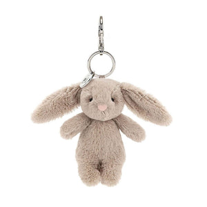 Meet the Bashful Bunny Bag Charm! Super-soft fur, floppy ears & a bright smile make this little fluffball the perfect companion for your on-the-go adventures.