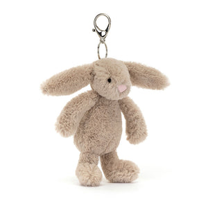 Angle view of Jellycat Bashful Beige Bunny Bag Charm (2025), highlighting the playful expression and cuddly appearance.