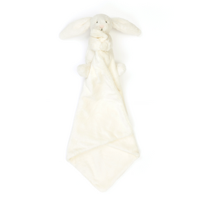 Ready for Bedtime: The Jellycat Bashful Cream Bunny Soother's cuddly bunny hangs with its attached blanket below, beckoning for bedtime snuggles.