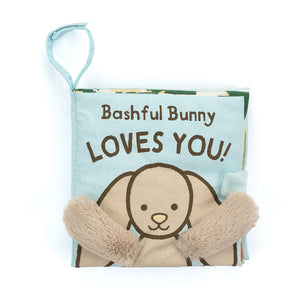 Straight On View:  Gift your baby a world of discovery with Bashful Bunny Loves You! This 15 cm x 15 cm sensory cloth book features a bunny with cuddly arms.