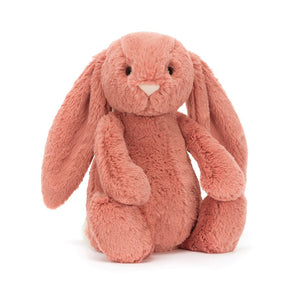 Jellycat Bashful Bunny Sorrel tilted slightly, showcasing its super soft pink fur, floppy ears, and sweet pastel suedette nose.