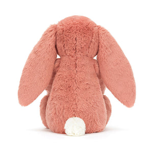 Back view of Jellycat Bashful Bunny Sorrel, featuring its luxuriously soft pink fur and charming cream silky bobtail.