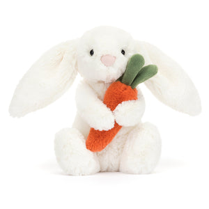 Front View: Jellycat Bashful Carrot Bunny plush white bunny holding a carrot.