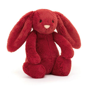 Front View: A soft, plush cranberry-coloured Christmas bunny toy wearing a festive outfit.