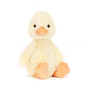 Front View: A plush Jellycat Bashful Duckling sitting upright with soft yellow fur, an orange beak, and flappy feet.