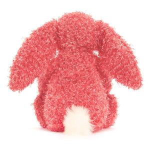 Behind: Back view of Jellycat Bashful Holly Bunny plush toy, showing the full length of its tail and the curly fur.