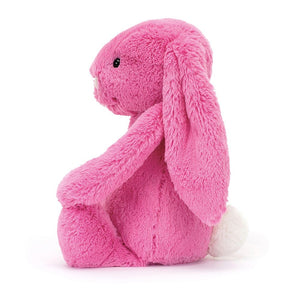 A side view of Jellycat Bashful Hot Pink Bunny.