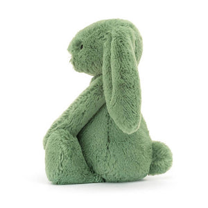 Side View: A side view of a cuddly ivy green Christmas bunny toy, showcasing its three-dimensional shape.