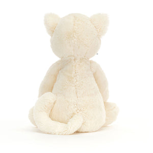 Back view – Rear view of the plush kitten, highlighting its fluffy tail and rounded ears.