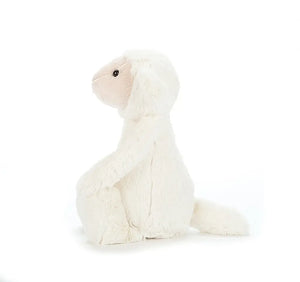 Ready for cuddles! Jellycat's Bashful Lamb boasts buttercreme fur, adorable droopy ears, and a pose perfect for snuggles and playtime.