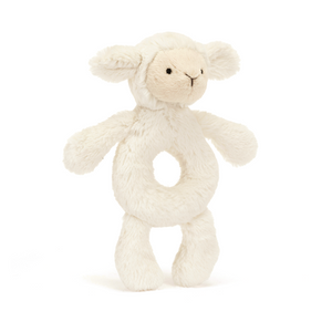 Jellycat Bashful Lamb Ring Rattle at an angle, showcasing its soft vanilla cream fur made from recycled fibers, ring-shaped tummy for easy grasping.
