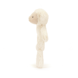 Side profile of the Jellycat Bashful Lamb Ring Rattle, showing its full height.