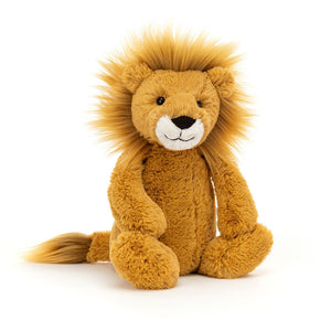 Jellycat Bashful Lion plush toy sitting upright with golden fur and a fluffy mane on a white background.