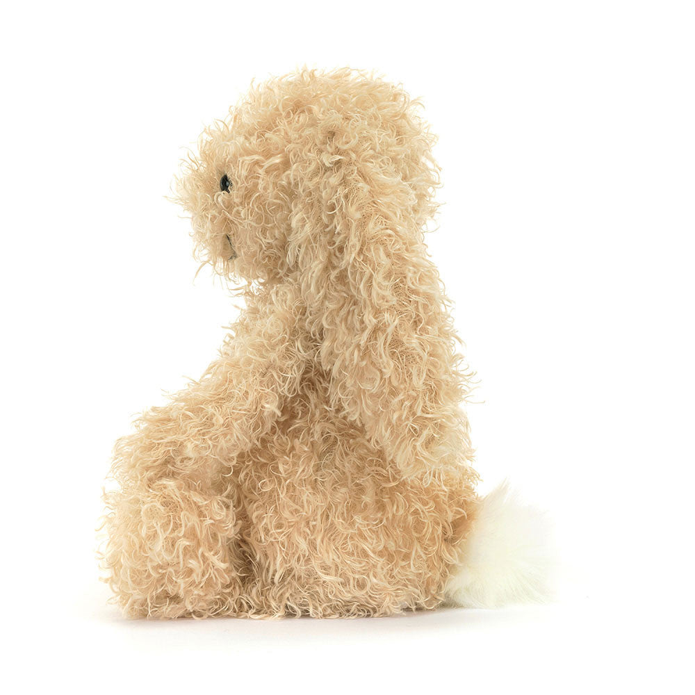 Side profile of Jellycat Bashful Luxe Bunny Curly plush toy showing fluffy white tail and textured coat.