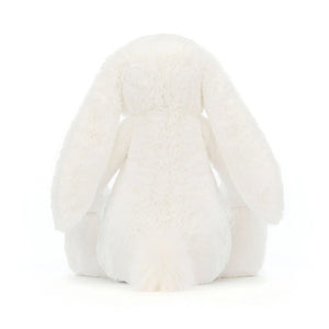 A rear view of Jellycat Bashful Luxe Bunny Luna, with a white fluffy tail.