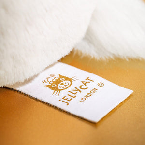An image of Jellycats Luxe range golden stitched tag.