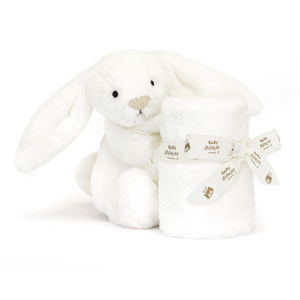 Softest White Jellycat Bashful Luxe Bunny Luna Soother at an angle, holding a cloud-like soother that is neatly tied with a Jellycat baby ribbon.
