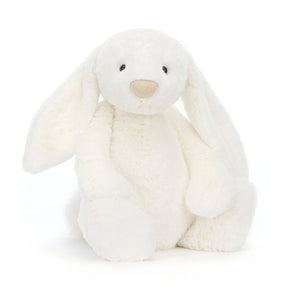 Jellycat Bashful Luxe Bunny Luna with soft white fur and a glittery golden nose, in a sitting position.