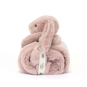 The perfect size for on-the-go snuggles, the Jellycat Bashful Luxe Bunny Rosa Blankie rolls up neatly. Featuring luxuriously soft fabric and a sweet bunny friend. (Side view)