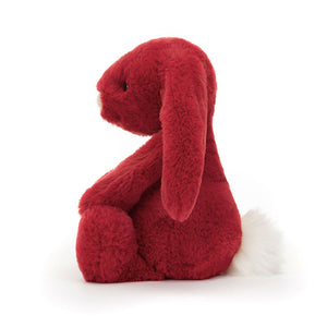 Side: Side view of Jellycat Bashful Luxe Bunny Scarlett, highlighting her soft fur and the glittery-pink nose.