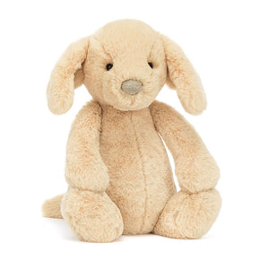 Front view of Jellycat Bashful Luxe Puppy Orlando, showing its golden beige fur and floppy ears.