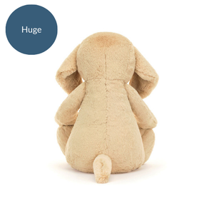 Image 2 (Back View - Huge): A rear view of the Jellycat Bashful Luxe Puppy Orlando in huge size, showing off its little tail and cozy, huggable fur.