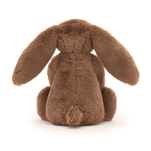 Back View: The back of a plush nutmeg-coloured Christmas bunny toy.