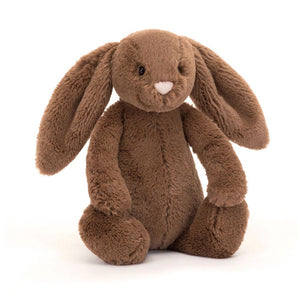 Front View: A soft, plush nutmeg-coloured Christmas bunny toy.