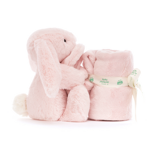 Double the comfort! The Jellycat Bashful Pink Bunny Soother features a soft blanket and a bunny holding on, perfect for bedtime snuggles.
