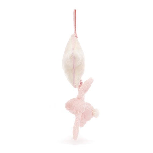 Lullaby time! Soft pink bunny and cream star with piping hanging sideways. Jellycat Bashful Pink Musical Pull, perfect for a crib.