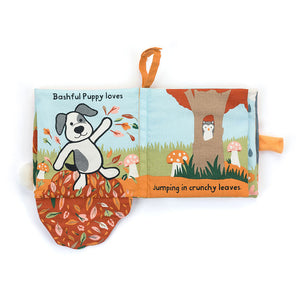 Open  View:  Bashful Puppy Loves You cloth book: 15 cm x 15 cm of engaging textures, bright colors, and lift-up flaps for sensory play and early learning.