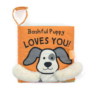 Straight On View: Spark your baby's curiosity with Bashful Puppy Loves You, a feature-rich cloth book with soft textures, lift-up flaps, and adorable puppy paw details. 