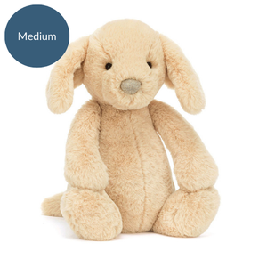 Front view of Jellycat Bashful Luxe Puppy Orlando (Medium), showcasing its gentle black eyes, soft fur, and adorable floppy ears.