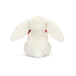 Showcasing its love, the Jellycat Bashful Red Love Heart Bunny holds a sweet heart tight. This cuddly companion offers comfort and joy from any angle. 