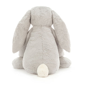 Back view of Jellycat Bashful Silver Bunny showcasing its soft silver fur, rounded back, and adorable bunny tail.