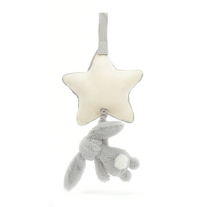 Backside view of the Jellycat Bashful Silver Bunny Musical Pull, emphasizing its long floppy ears and soft fur made from recycled materials, with the star-shaped musical pull .